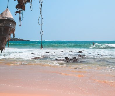 A photo of a surfer at Marissa beach in Sri Lanka near our homestay.